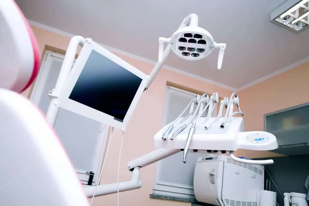 Empty dental treatment room with the chair and overhead light