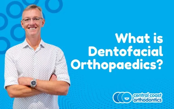 Banner reading What Is Dentofacial Orthopaedics, with an orthodontist standing
