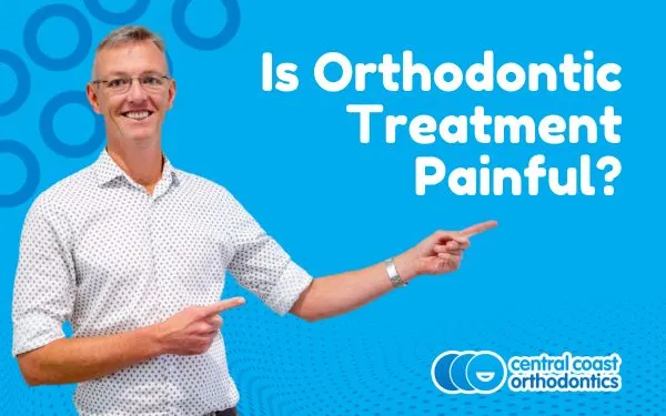 Banner reading Is Orthodontic Treatment Painful, with an orthodontist pointing